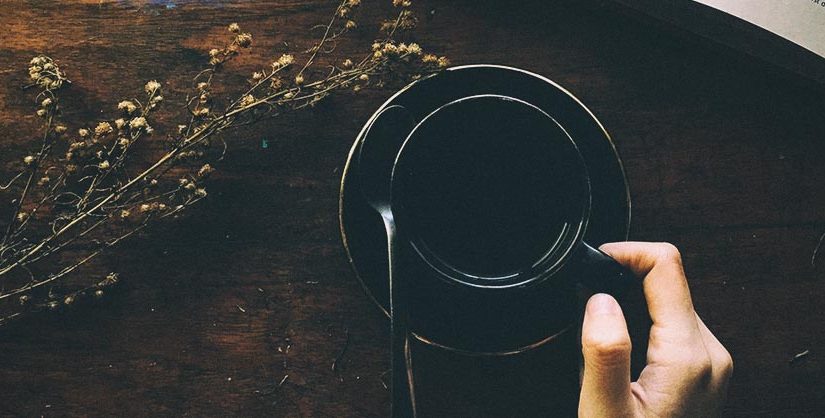 Holding coffee cup | novel writing tool
